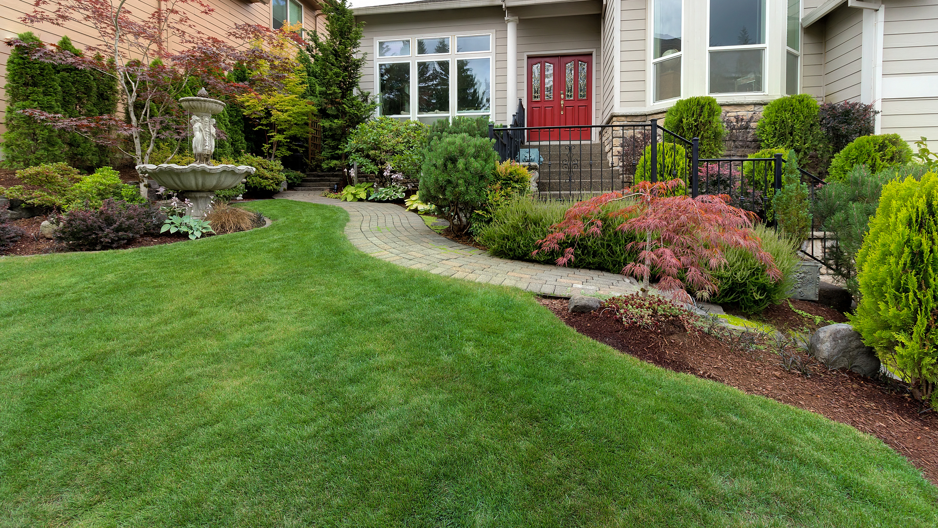 A home in Skippack, PA with extravagant landscaping and a healthy lawn.