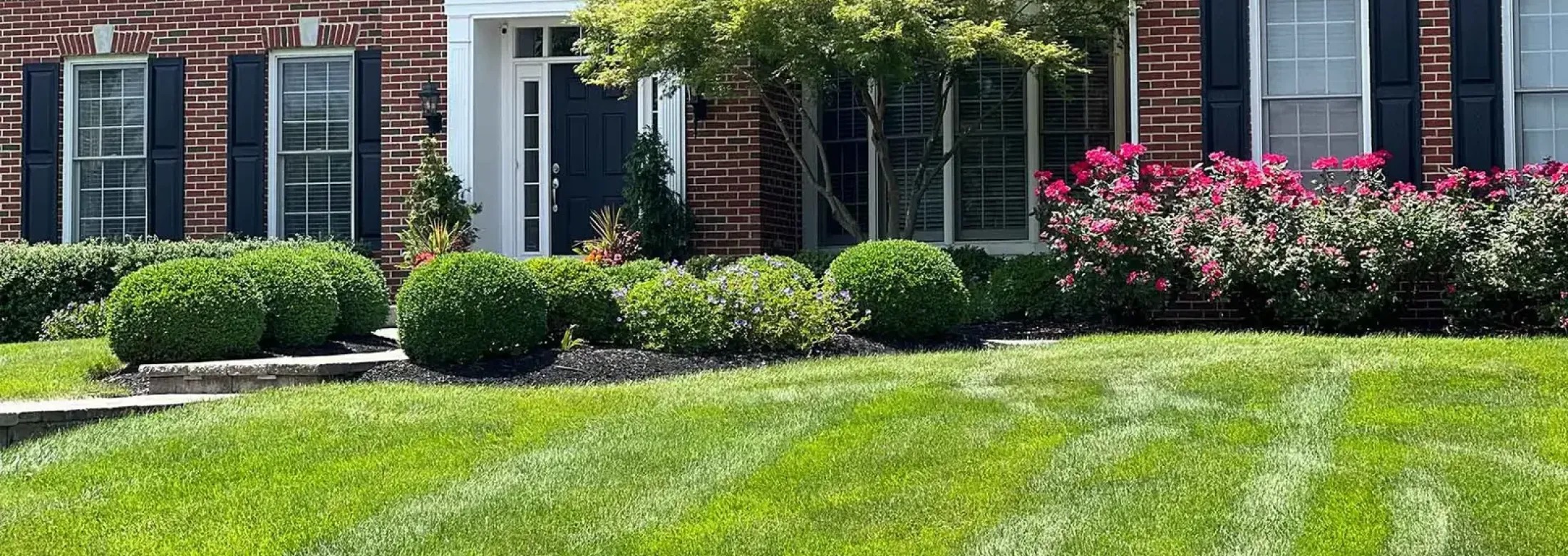 brick home with nice yard